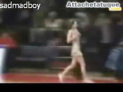 Cheerleader removes her top during a basketball game